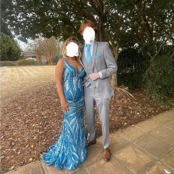 The beautiful dress is Jovani, a size 4, no alterations and has been worn once. - Picture 2 of 3